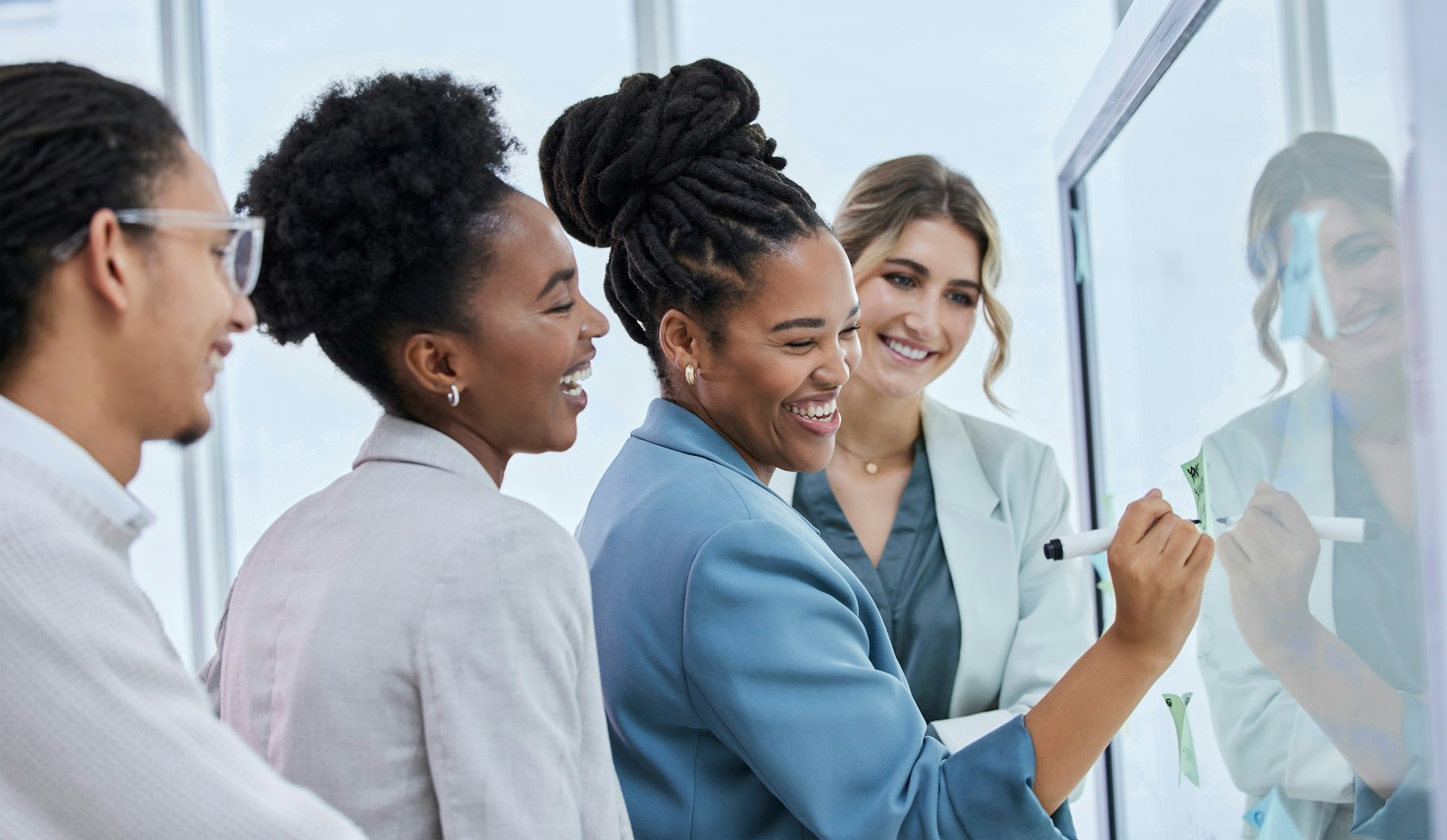 Laughing, planning and business people with a strategy on a board, meeting and working on a goal. T